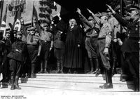 Landesbischof Ludwig Müller, der künftige Reichsbischof, 1933 beim Heil-Gruß für Hitler. Foto: Wikipedia/Bundesarchiv